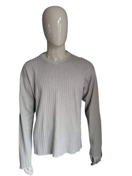 Pull Quiksilver. Motif rayé beige. Taille XL