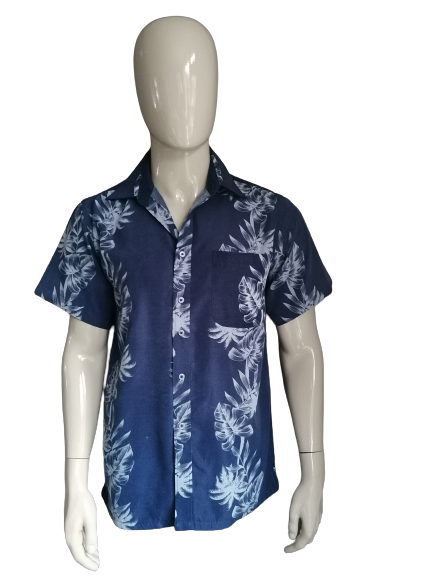 Jean Blue Shirt manches courtes. Motif d'impression de feuilles bleue. Taille M.