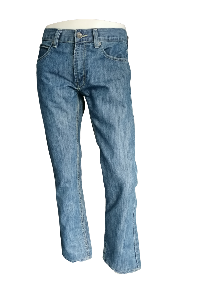 Petrol jeans. Colored blue. Size W32 - 30. Pants have been shortened.