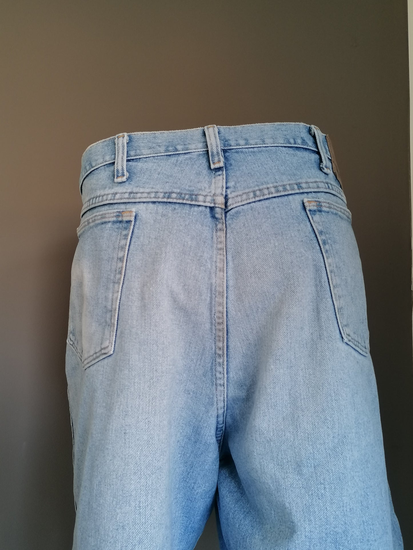 Wrangler jeans shorts. Colored light blue. Size W40.
