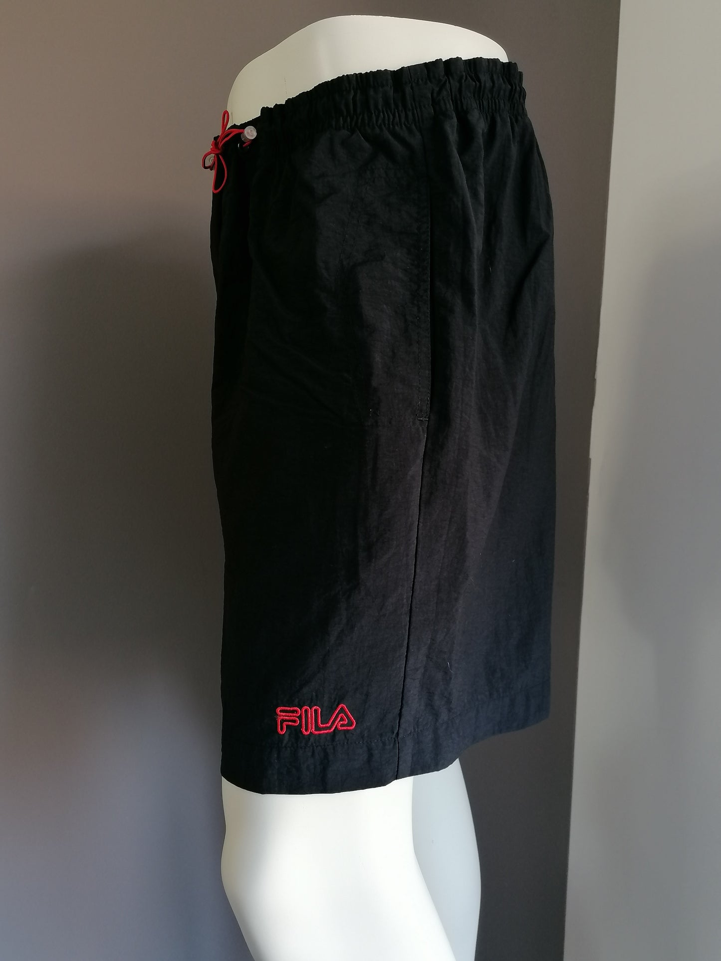 Fila swimming trunks. Colored black. Size XL.