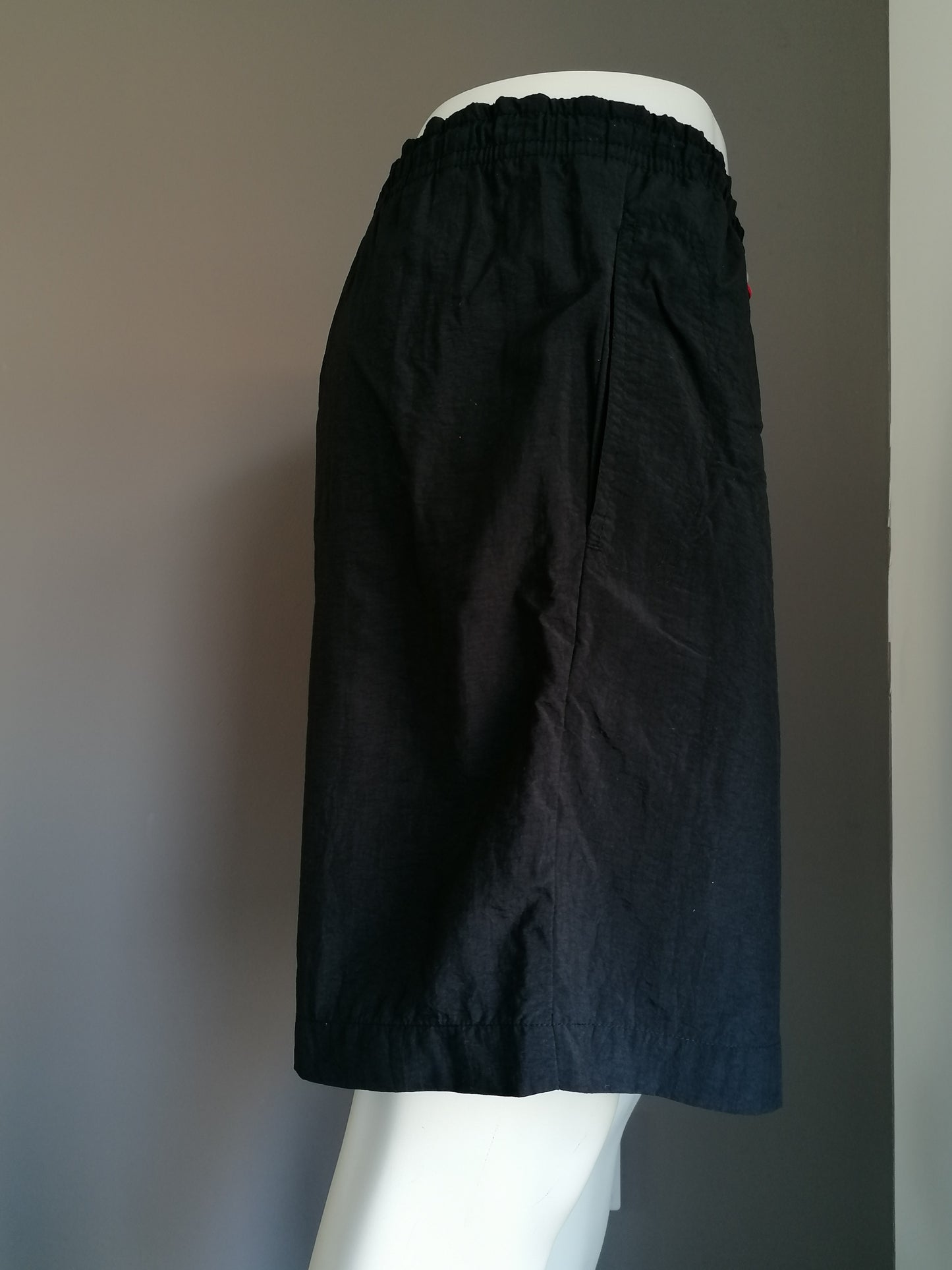 Fila swimming trunks. Colored black. Size XL.