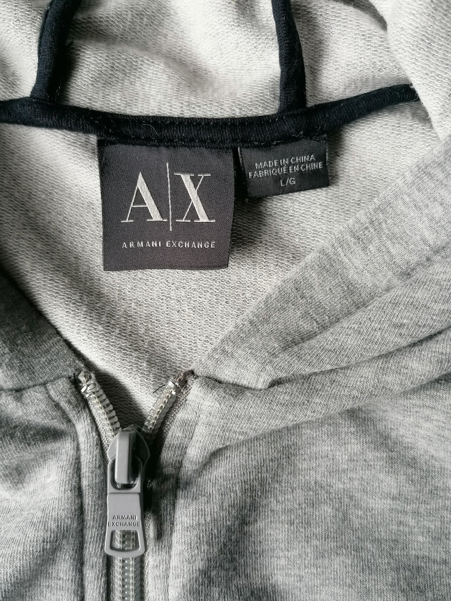 Armani Exchange body warmer with hood. Gray colored. Size L. Sweat fabric.