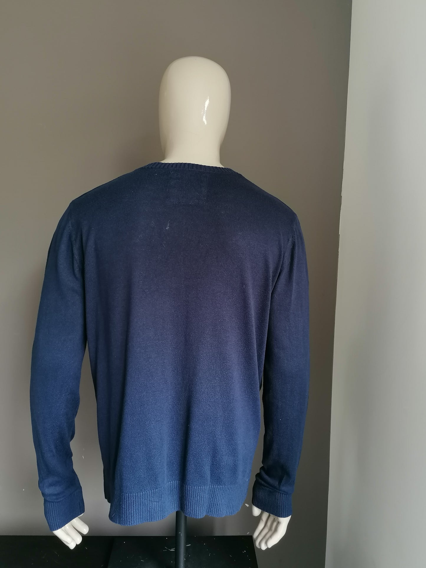 Hollister sweater with V-neck. Dark blue colored. Size XL.