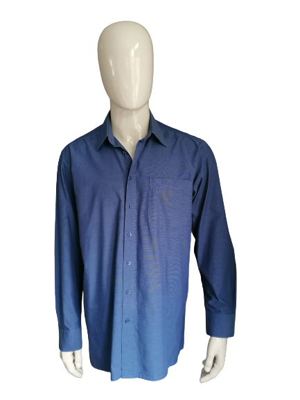 Chemise Elmior. De couleur bleu foncé. Taille 41/L.