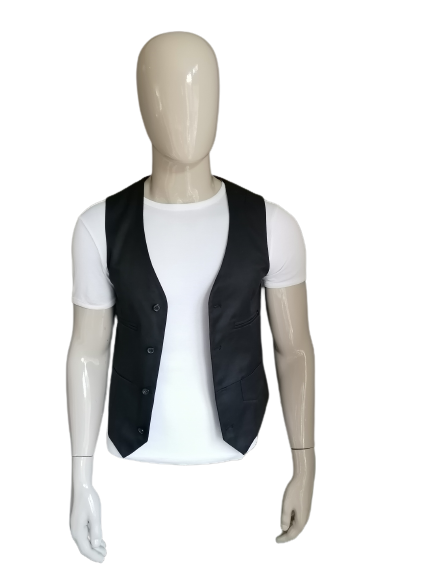 Chaleco devred. De color negro. Talla S.