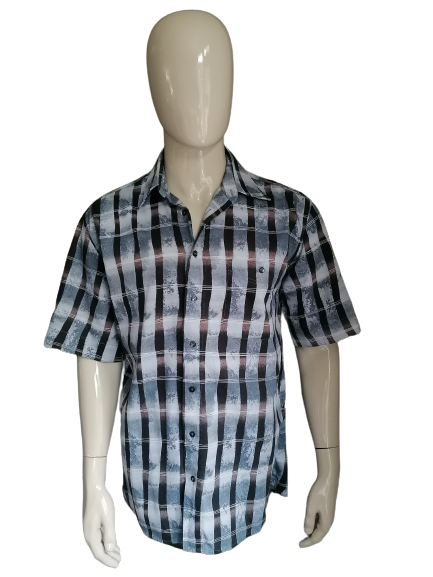 Vintage Jupiter 90's shirt short sleeve. Blue black print. Size L. Long model.