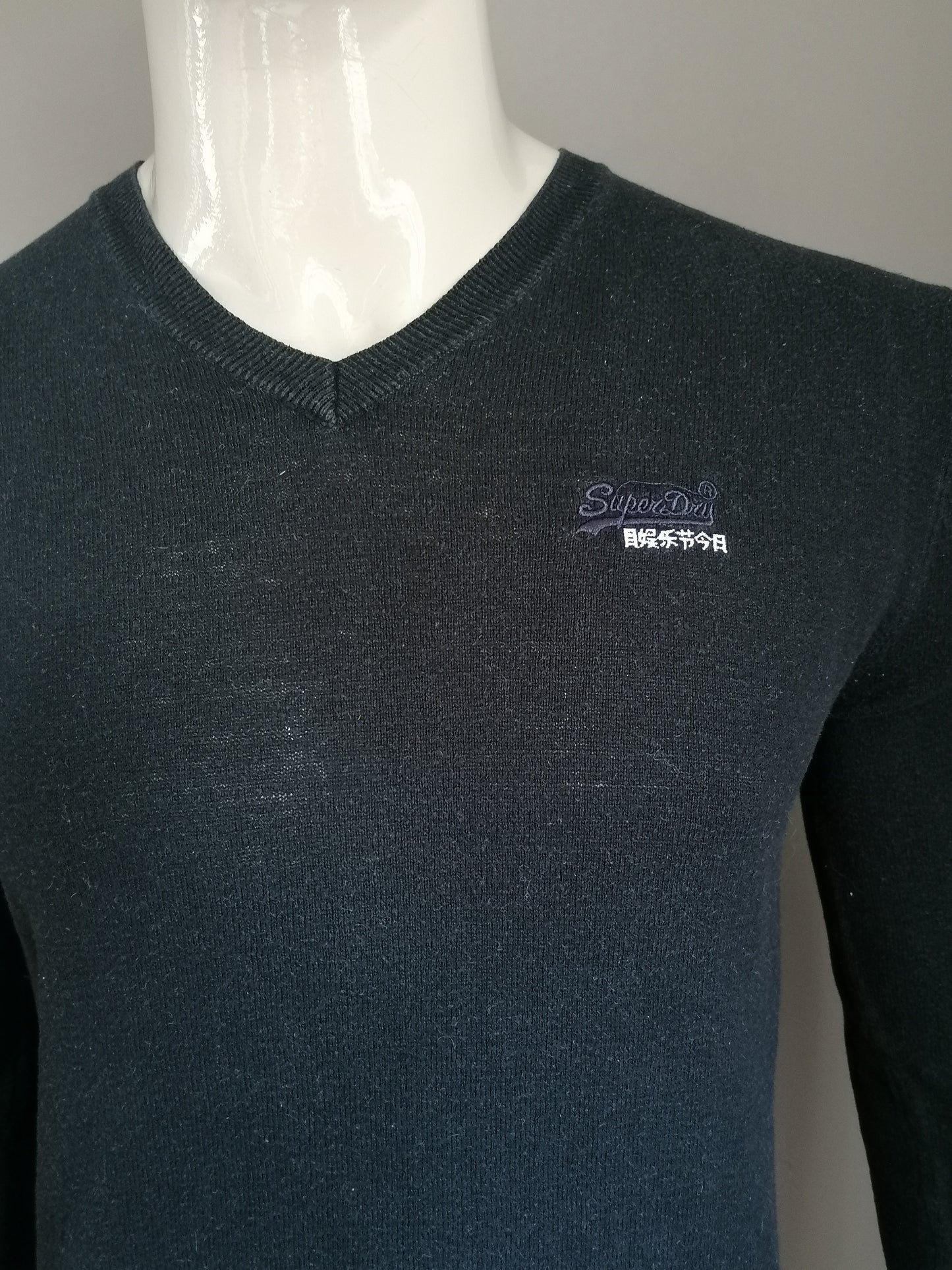 Superdry sweater with V-neck. Black colored. Size M.