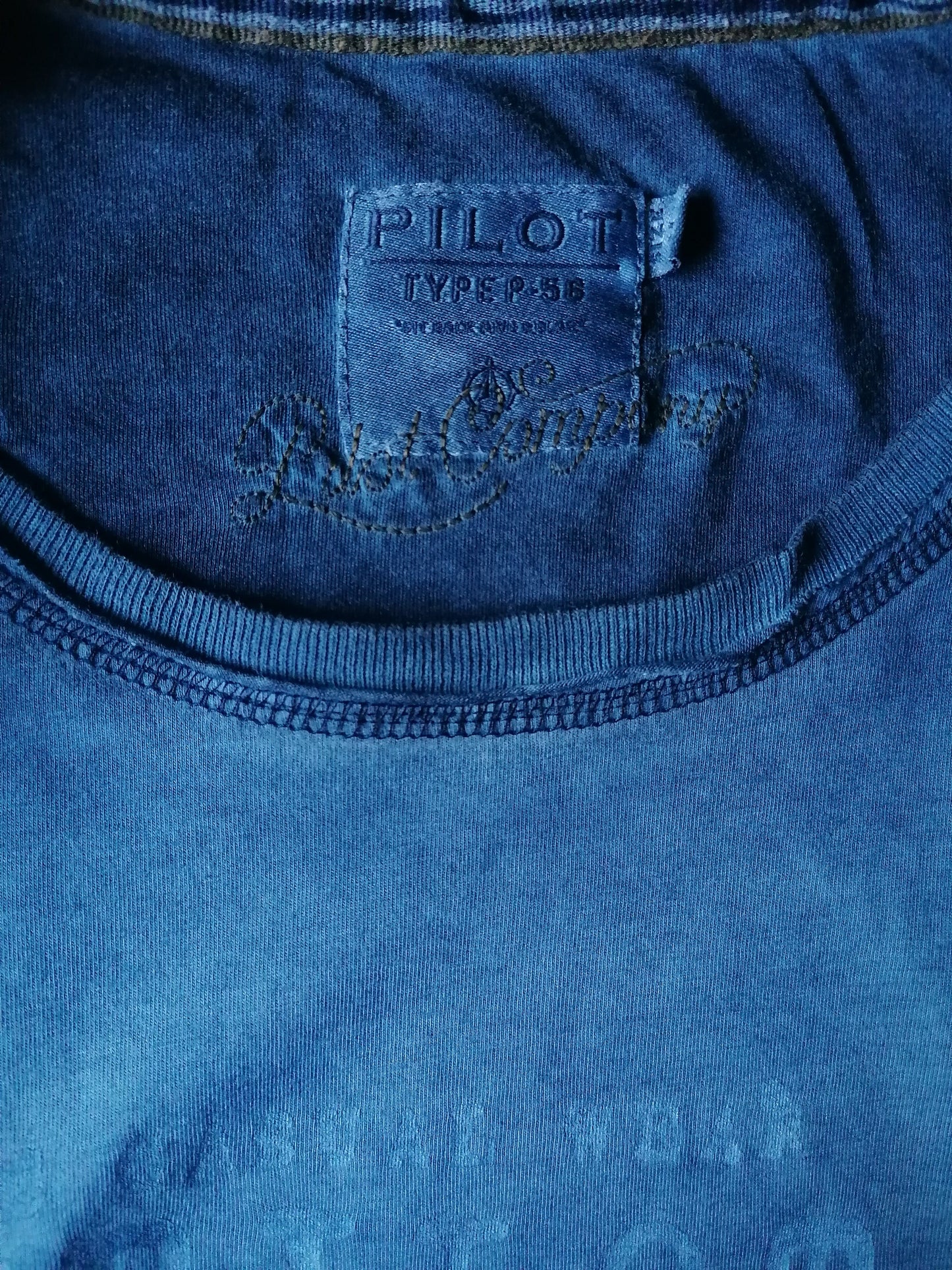 Pilot Longsleeve. Blue mixed with print. Size M.
