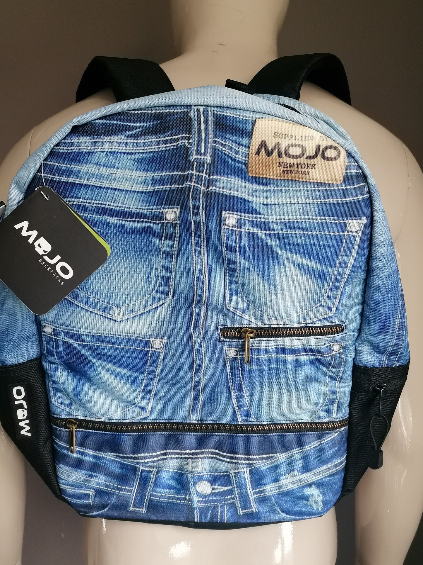 Mojo backpacks backpack. Blue jeans look print. Some inside pocket.