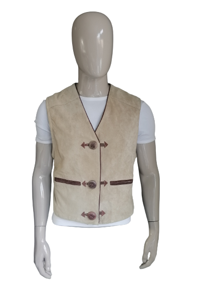 Leather / suede waistcoat. Beige brown colored. Large separate buttons. Embroidery rear. Size M.