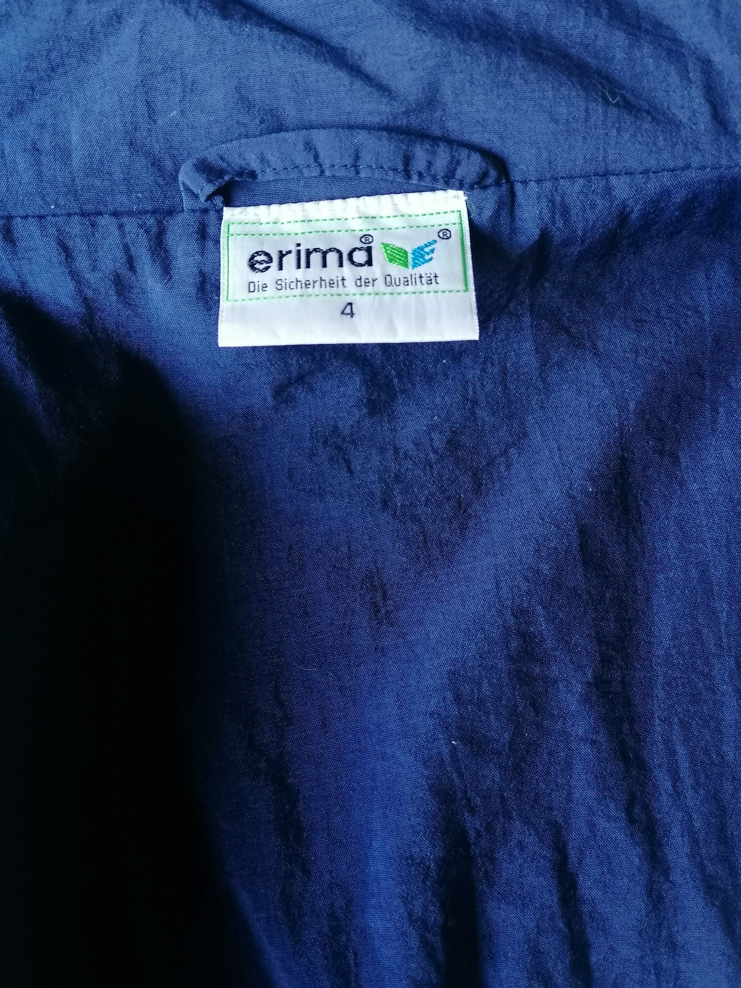 Vintage Erima 80's-90's trainingsjack. Blauw Wit Geel gekleurd. Maat XL.