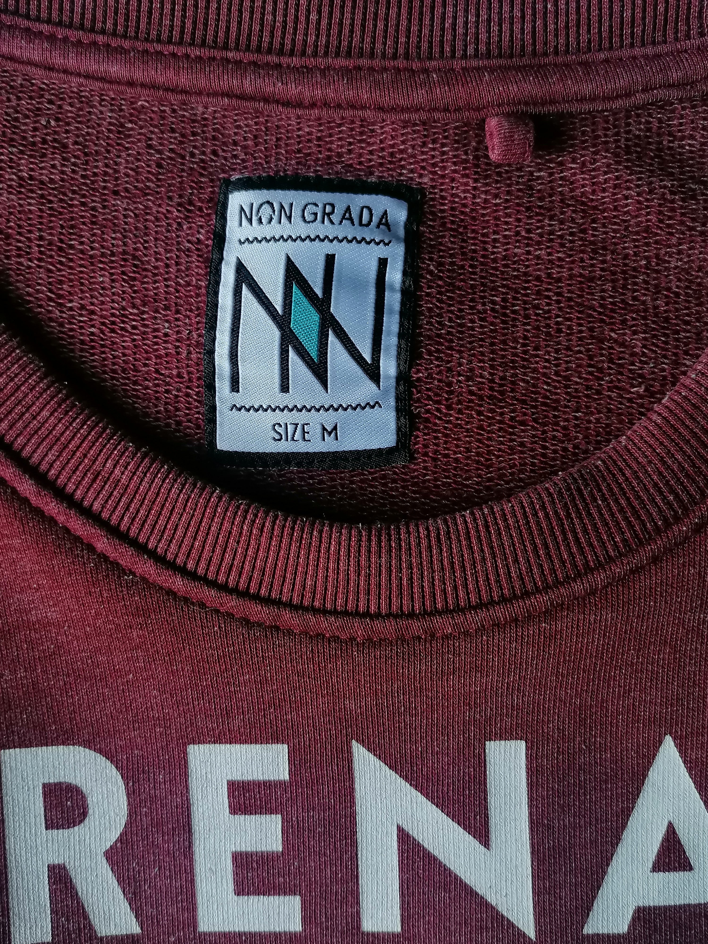Non Grada sweater. Red mixed with print. Size M