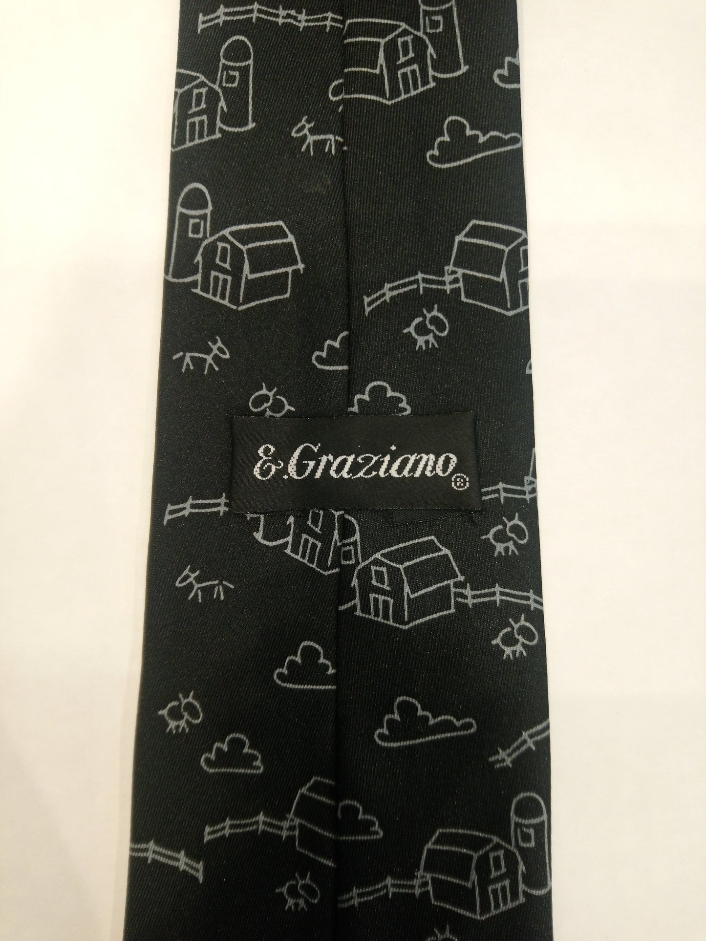 E.Graziano polyester tie. Black with cow motif.