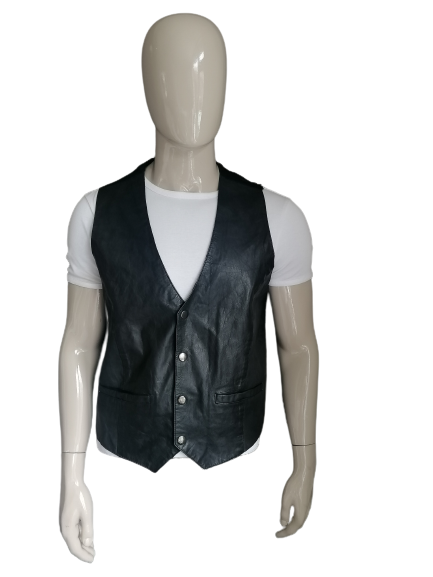 In-Frac-Tigs leather waistcoat with press studs. Black colored. Size L.