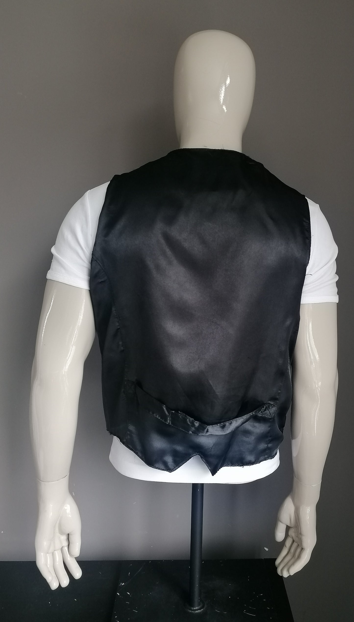 In-Frac-Tigs leather waistcoat with press studs. Black colored. Size L.