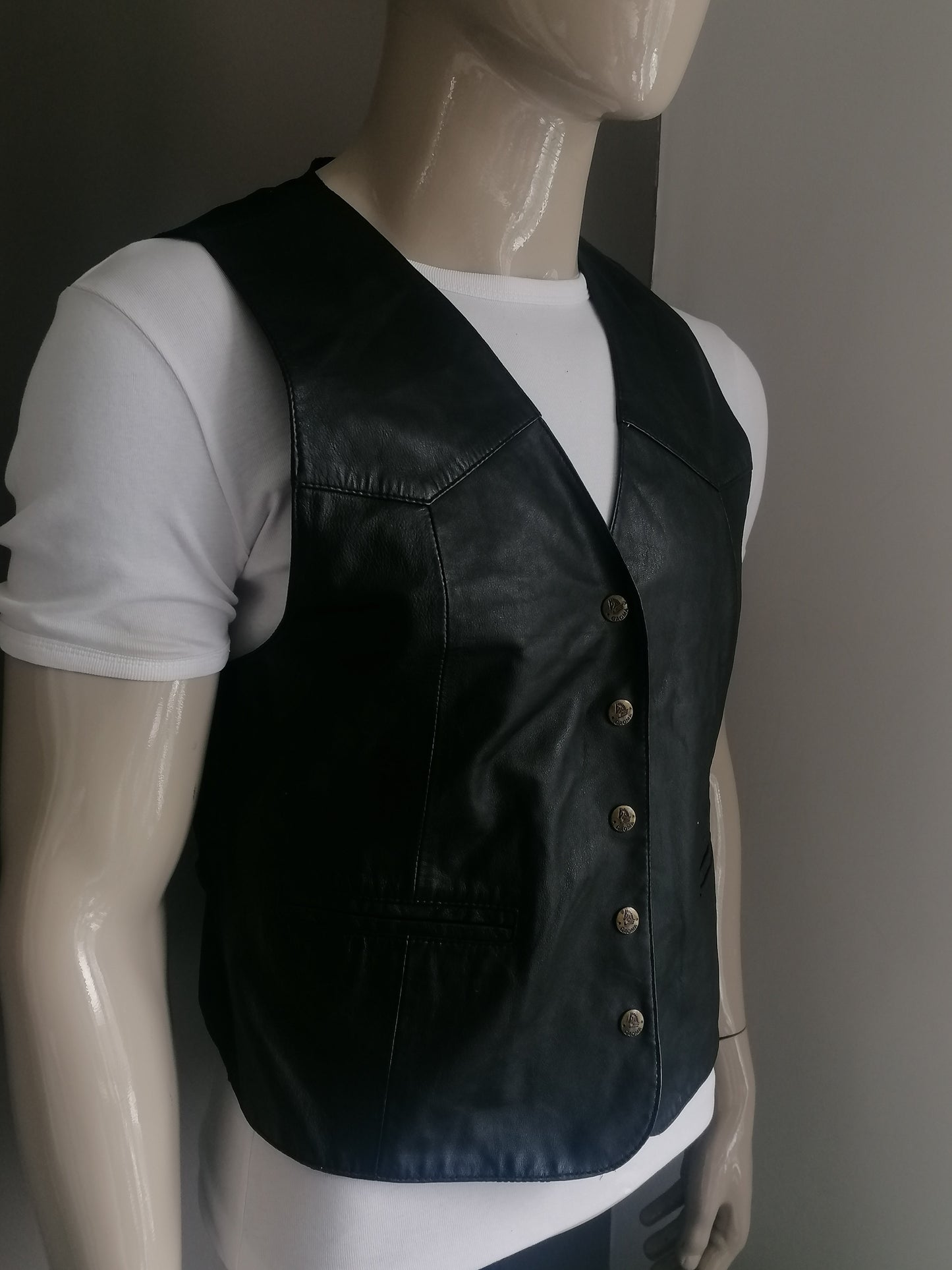 Fashion studio leather waistcoat with press studs. Black colored. Size M.