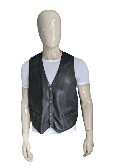 Leather waistcoat with press studs and 1 inner pocket. Black colored. Leather back. Size L. #305